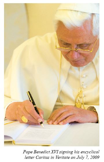 Pope Benedict XVI signing Encyclical Letter