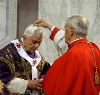 The Pope receiving the ashes from Cardinal Tomko