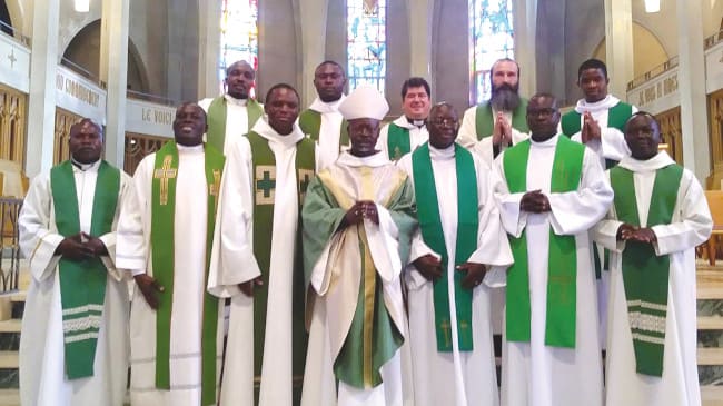 Bishop Madega accompanied by priests -  Sherbrooke Cathedral